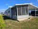 Mobile home with screened porch and carport at 12501 Ulmerton Rd # 188, Largo, FL 33774