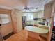 Kitchen with stainless steel refrigerator and wood cabinets at 12501 Ulmerton Rd # 188, Largo, FL 33774