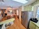 Open kitchen with stainless steel refrigerator and island at 12501 Ulmerton Rd # 188, Largo, FL 33774