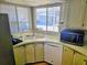 Kitchen with white appliances and wood cabinets at 12501 Ulmerton Rd # 188, Largo, FL 33774