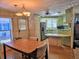 Bright kitchen and dining area with wood flooring and modern appliances at 12501 Ulmerton Rd # 188, Largo, FL 33774