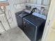 Small laundry room with washer and dryer at 12501 Ulmerton Rd # 188, Largo, FL 33774