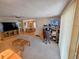 Open living space with home office and view into dining area at 12501 Ulmerton Rd # 188, Largo, FL 33774