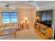 Cozy living room featuring a large TV and comfortable seating at 12501 Ulmerton Rd # 188, Largo, FL 33774