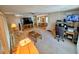 Open living space with home office and view into dining area at 12501 Ulmerton Rd # 188, Largo, FL 33774