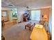 Spacious living room with ample natural light and a home office area at 12501 Ulmerton Rd # 188, Largo, FL 33774