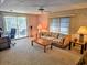 Living room with sofa, coffee table, and carpet flooring at 12501 Ulmerton Rd # 188, Largo, FL 33774