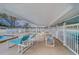 Relaxing poolside patio furniture under covered area at 12501 Ulmerton Rd # 188, Largo, FL 33774