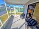 Relaxing screened porch with wicker chairs, overlooking the community at 12501 Ulmerton Rd # 188, Largo, FL 33774