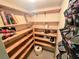 Well-organized storage room with shelves and hanging organizers at 12501 Ulmerton Rd # 188, Largo, FL 33774