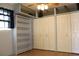 Bedroom features light-colored hardwood floors, built-in shelving, and ample closet space at 1322 Kenmore St, Port Charlotte, FL 33952