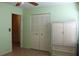 Bedroom with tiled floors, large closet, and armoire at 1322 Kenmore St, Port Charlotte, FL 33952
