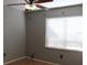 Bedroom featuring neutral walls, tiled floors, and natural light from window at 1322 Kenmore St, Port Charlotte, FL 33952