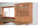 Charming kitchen details including window view, decorative display shelving and tile countertops at 1322 Kenmore St, Port Charlotte, FL 33952