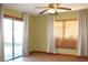 Bright, light-filled room with tile floors and sliding glass doors leading to the outside at 1322 Kenmore St, Port Charlotte, FL 33952