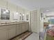 Elegant bathroom with granite countertops and updated cabinetry at 134 Mariner Dr # 134, Tarpon Springs, FL 34689