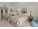 Comfortable bedroom with a queen-size bed and dresser at 134 Mariner Dr # 134, Tarpon Springs, FL 34689