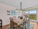 Elegant dining area with a table for six and access to balcony at 134 Mariner Dr # 134, Tarpon Springs, FL 34689