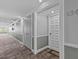 Building hallway with carpet flooring and neutral wall colors at 134 Mariner Dr # 134, Tarpon Springs, FL 34689
