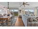 Living room and dining area with tiled floors and balcony access at 134 Mariner Dr # 134, Tarpon Springs, FL 34689