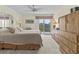 Spacious main bedroom with large dresser and private balcony at 134 Mariner Dr # 134, Tarpon Springs, FL 34689