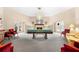 Community recreation room with fireplace and pool table at 134 Mariner Dr # 134, Tarpon Springs, FL 34689