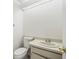 Small bathroom with toilet, sink, and bathtub at 13817 Stone Mill Way, Tampa, FL 33613