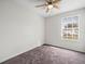 Bedroom with ceiling fan and window at 13817 Stone Mill Way, Tampa, FL 33613