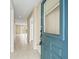 Bright entryway with tiled floors leading to the living room at 13817 Stone Mill Way, Tampa, FL 33613