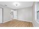 Spacious bedroom with light gray walls and wood-look floors at 1399 Grapeleaf Ct, Tarpon Springs, FL 34689