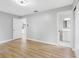 Bedroom with ensuite bathroom and wood-look flooring at 1399 Grapeleaf Ct, Tarpon Springs, FL 34689
