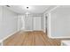 Light dining area with wood-look floors and modern lighting at 1399 Grapeleaf Ct, Tarpon Springs, FL 34689