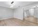 Open dining area with wood-look flooring and kitchen views at 1399 Grapeleaf Ct, Tarpon Springs, FL 34689