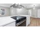 Modern kitchen with stainless steel appliances and breakfast bar at 1399 Grapeleaf Ct, Tarpon Springs, FL 34689