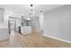 Open concept kitchen features stainless steel appliances and an island at 1399 Grapeleaf Ct, Tarpon Springs, FL 34689