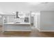 Modern kitchen features stainless steel appliances and a large island at 1399 Grapeleaf Ct, Tarpon Springs, FL 34689