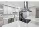 Modern kitchen with stainless steel appliances and breakfast bar at 1399 Grapeleaf Ct, Tarpon Springs, FL 34689