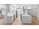 Modern kitchen with stainless steel appliances and breakfast bar at 1399 Grapeleaf Ct, Tarpon Springs, FL 34689