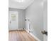 Bright laundry room with vinyl flooring and exterior access at 1399 Grapeleaf Ct, Tarpon Springs, FL 34689