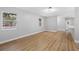 Spacious living area with light walls and wood-look floors at 1399 Grapeleaf Ct, Tarpon Springs, FL 34689