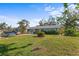 House exterior showcasing a well-maintained lawn and landscaping at 1515 15Th E St, Bradenton, FL 34208