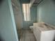 Small bathroom with shower and vanity at 1530 Davenport Dr, New Port Richey, FL 34655