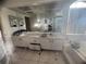 Double vanity bathroom with large mirror at 1530 Davenport Dr, New Port Richey, FL 34655