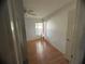 Simple bedroom with hardwood floors and window at 1530 Davenport Dr, New Port Richey, FL 34655