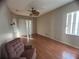 Bedroom with wood flooring and a ceiling fan at 1530 Davenport Dr, New Port Richey, FL 34655