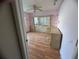Bedroom with wood floors and built in shelving at 1530 Davenport Dr, New Port Richey, FL 34655