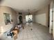 Living room with tiled floors and a view to the backyard at 1530 Davenport Dr, New Port Richey, FL 34655