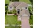 Two-story house with a three-car garage and large yard at 1553 Regal Mist Loop, Trinity, FL 34655