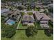 Aerial view showcasing the house and neighborhood at 1553 Regal Mist Loop, Trinity, FL 34655