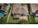 Aerial view of house, backyard and pool at 1553 Regal Mist Loop, Trinity, FL 34655